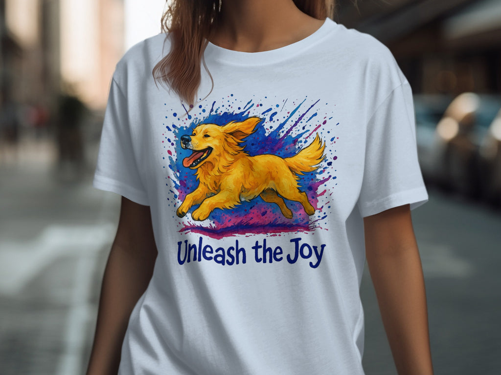 White t-shirt with a running golden retriever graphic and "Unleash the Joy" text.