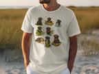 White t-shirt with a print of multiple black labs fishing and showing off their catches.