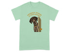 Dog peeking through doorway on a mint green t-shirt.