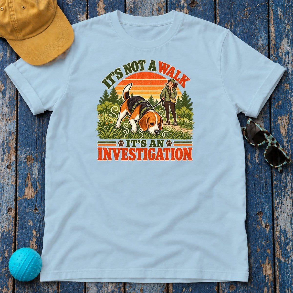 It's Not a Walk It's an Investigation Beagle T-Shirt in Light Blue - flat lay