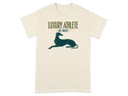 Cream t-shirt with "Luxury Athlete at Rest" text and a greyhound silhouette.