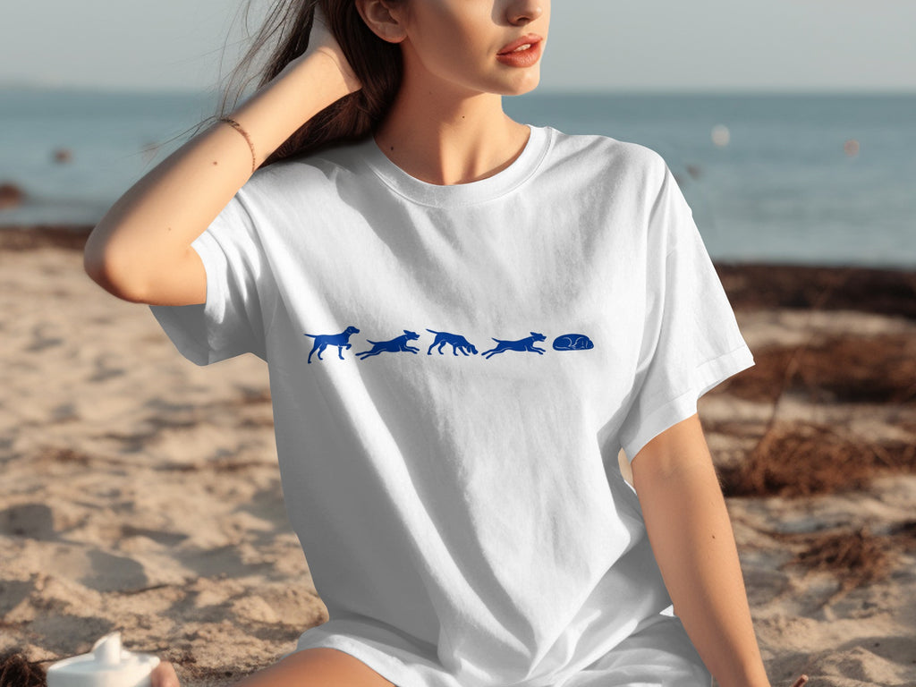 White t-shirt with a row of blue dog silhouettes in various poses