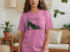 Pink t-shirt with a black dog silhouette and text "Stay curious, Sniff everything!".