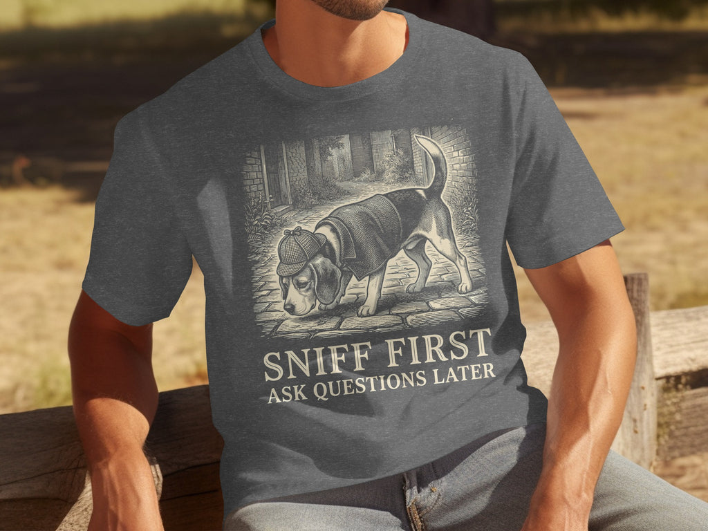 Dark gray t-shirt with a beagle wearing a deerstalker hat sniffing the ground.