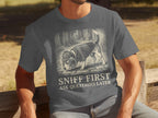 Dark gray t-shirt with a beagle wearing a deerstalker hat sniffing the ground.