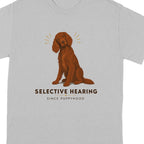 Brown dog sitting with "Selective Hearing" text on a gray t-shirt.