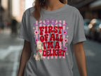 Gray t-shirt with pink ribbon, flowers, and text "First of all I'm a DELIGHT".