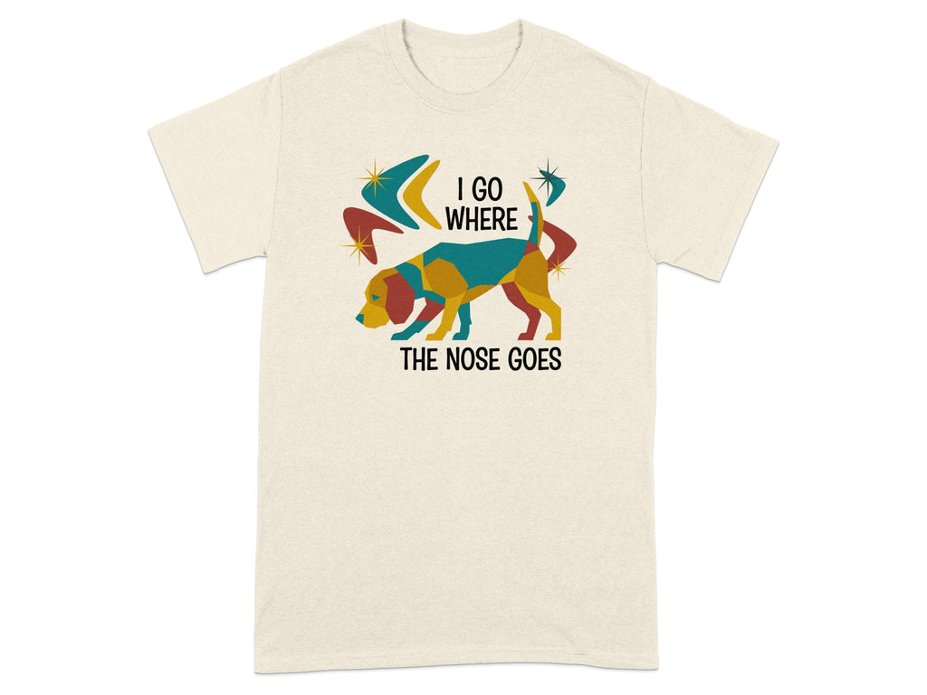 Cream t-shirt with graphic of colorful dog and text "I GO WHERE THE NOSE GOES".