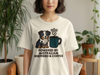 T-shirt graphic with a cartoon Australian Shepherd and coffee cup, text reads "POWERED BY AUSTRALIAN SHEPHERD & COFFEE".
