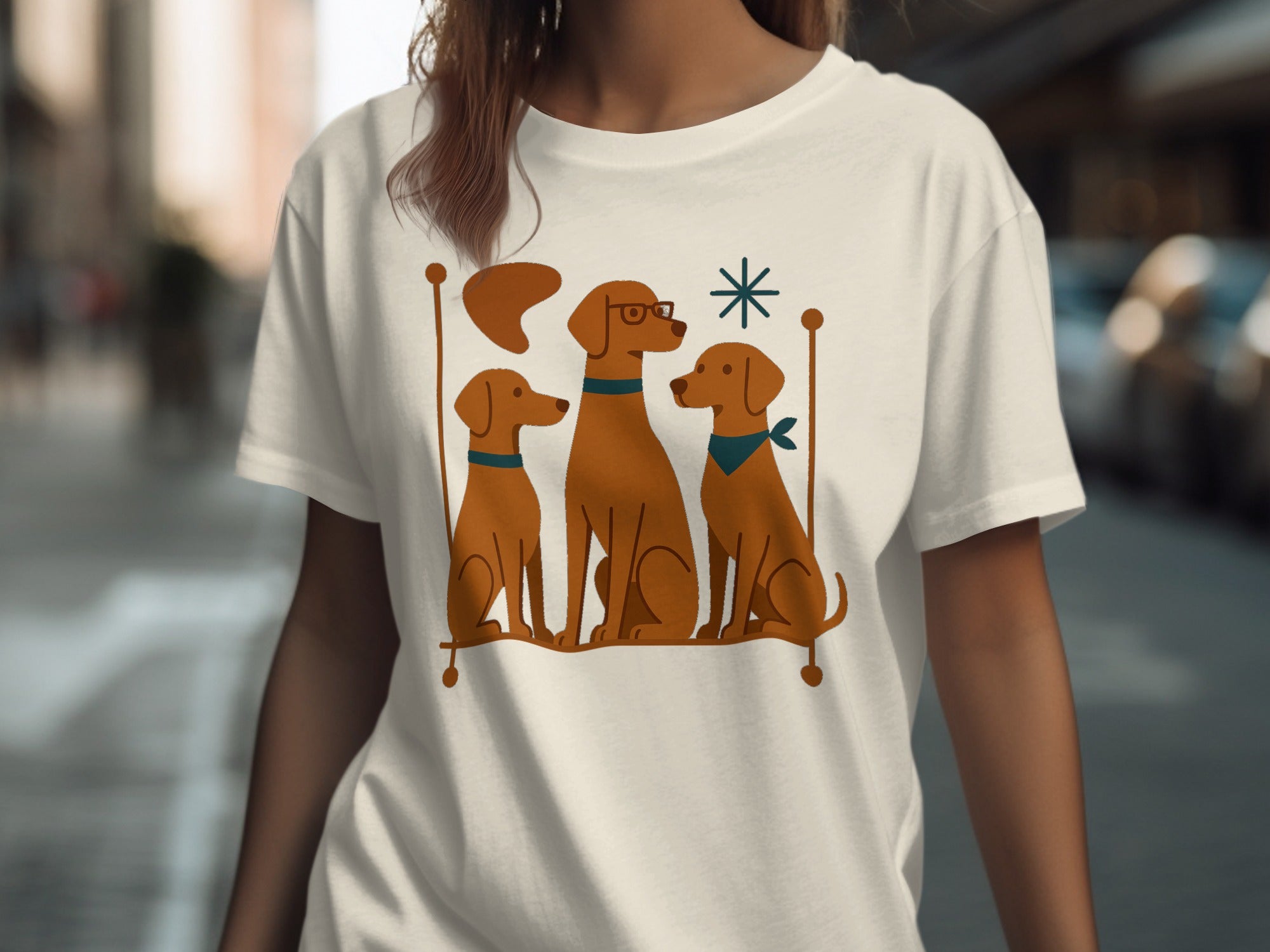 Three brown dogs with collars sit on a line, one wearing glasses.