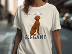 T-shirt with dog and "VELCRO, BUT MAKE IT ELEGANT" text.