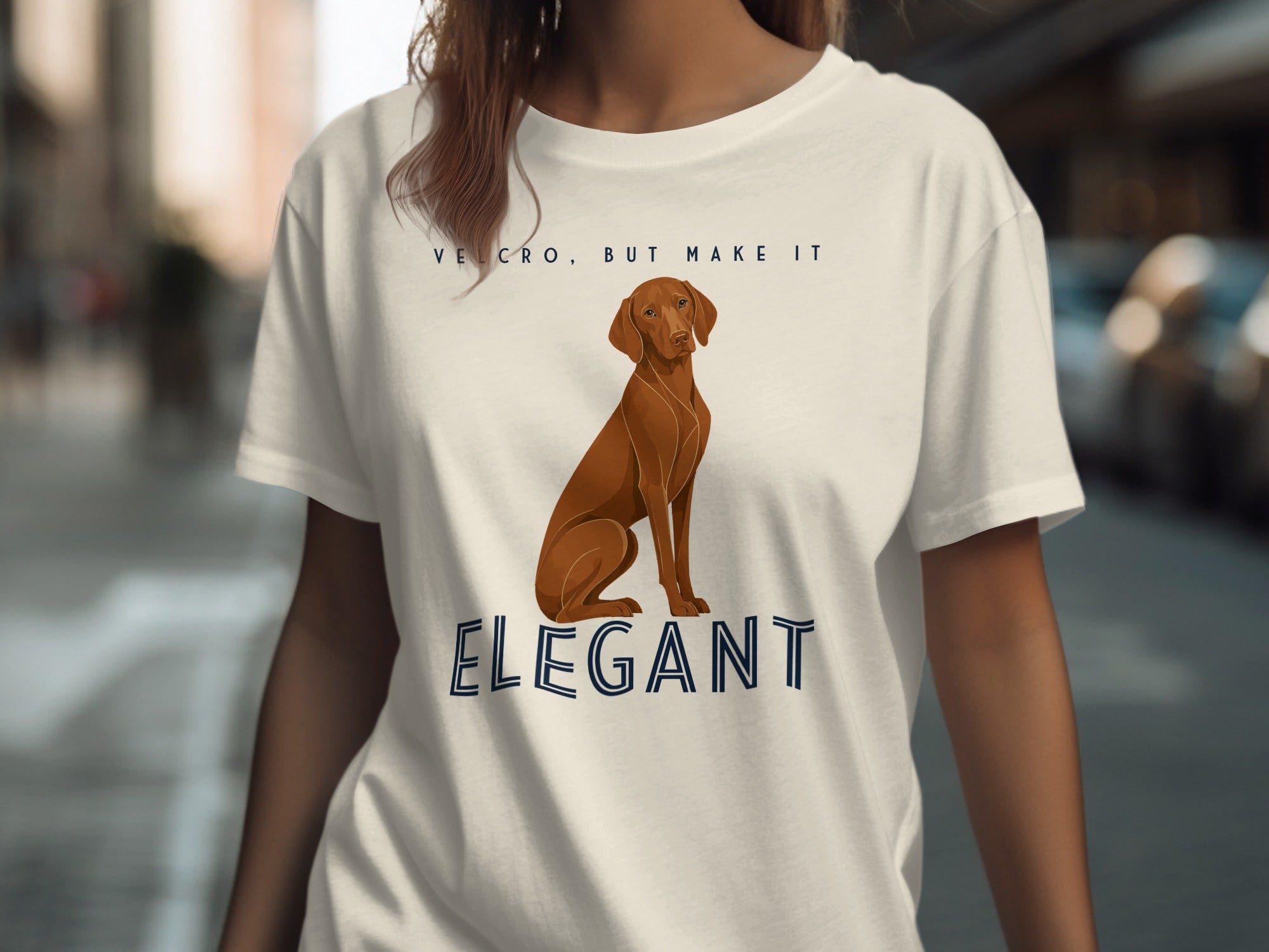 T-shirt with dog and "VELCRO, BUT MAKE IT ELEGANT" text.