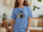 Dachshund emerging from a tunnel on a blue t-shirt.
