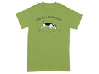 Beagle wearing a detective hat, with paw prints, on a green t-shirt.