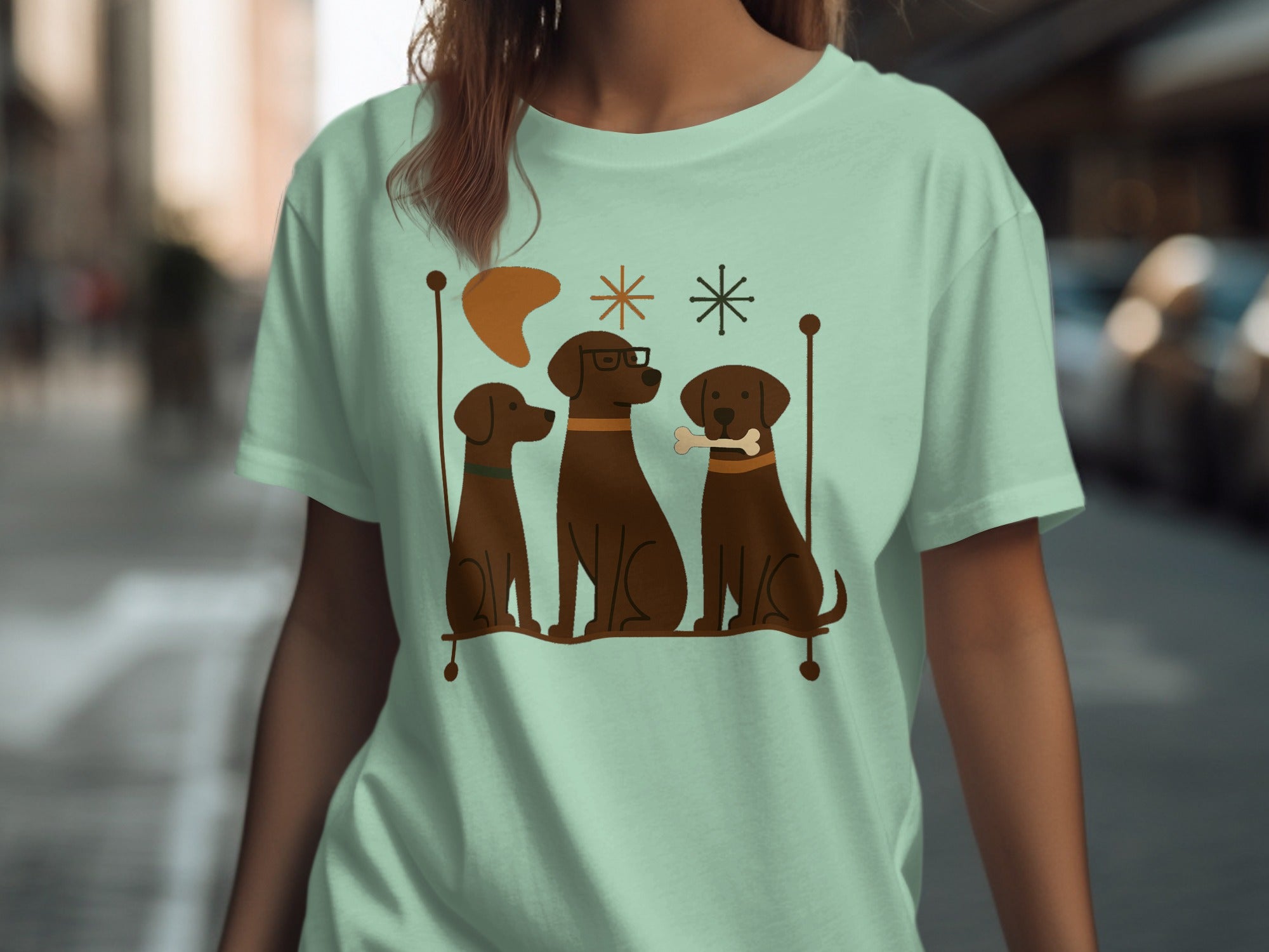 Three brown dogs with a bone and glasses sit on a perch.