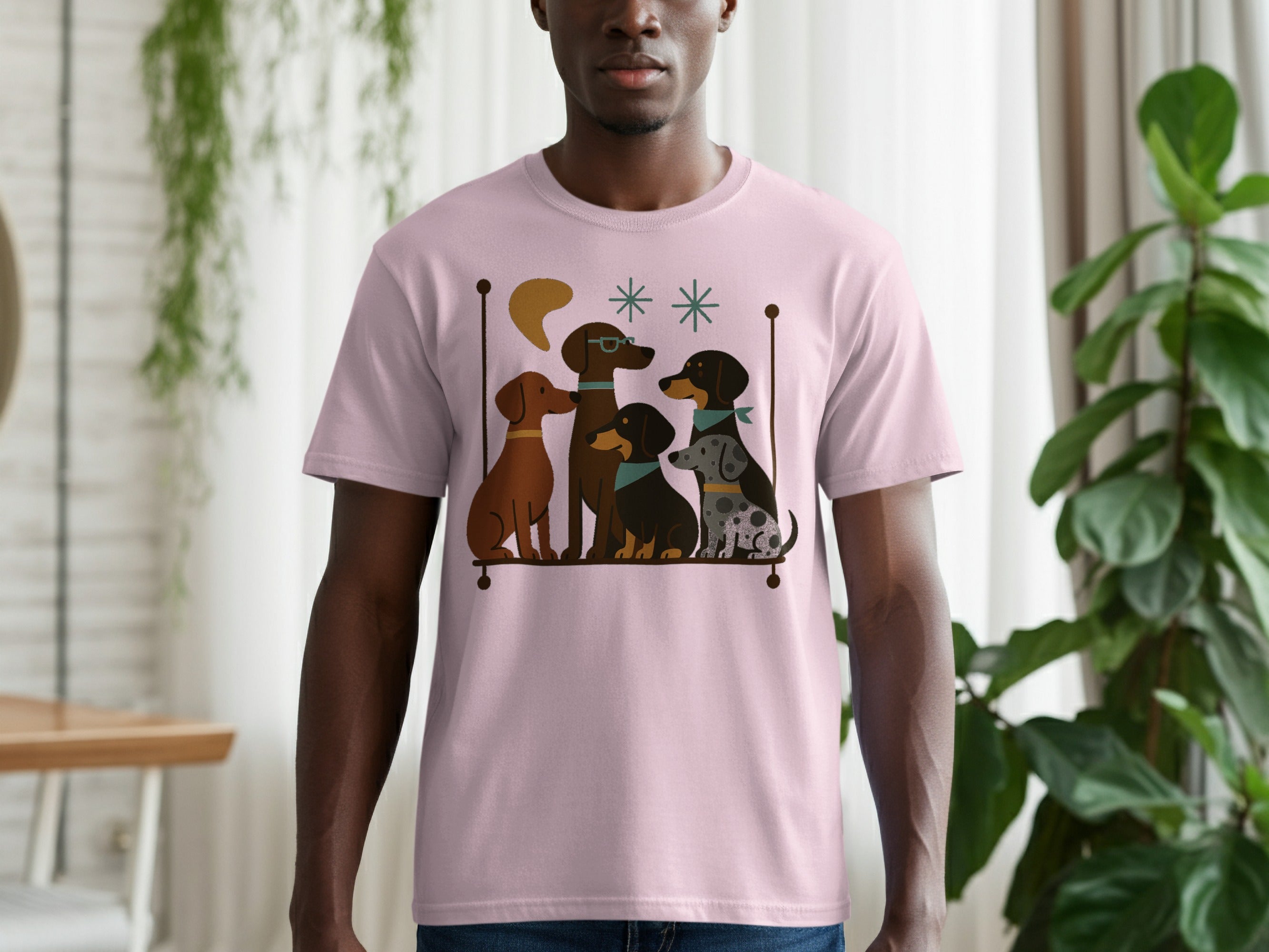 Pink t-shirt with a graphic of four cartoon dogs sitting on a shelf.
