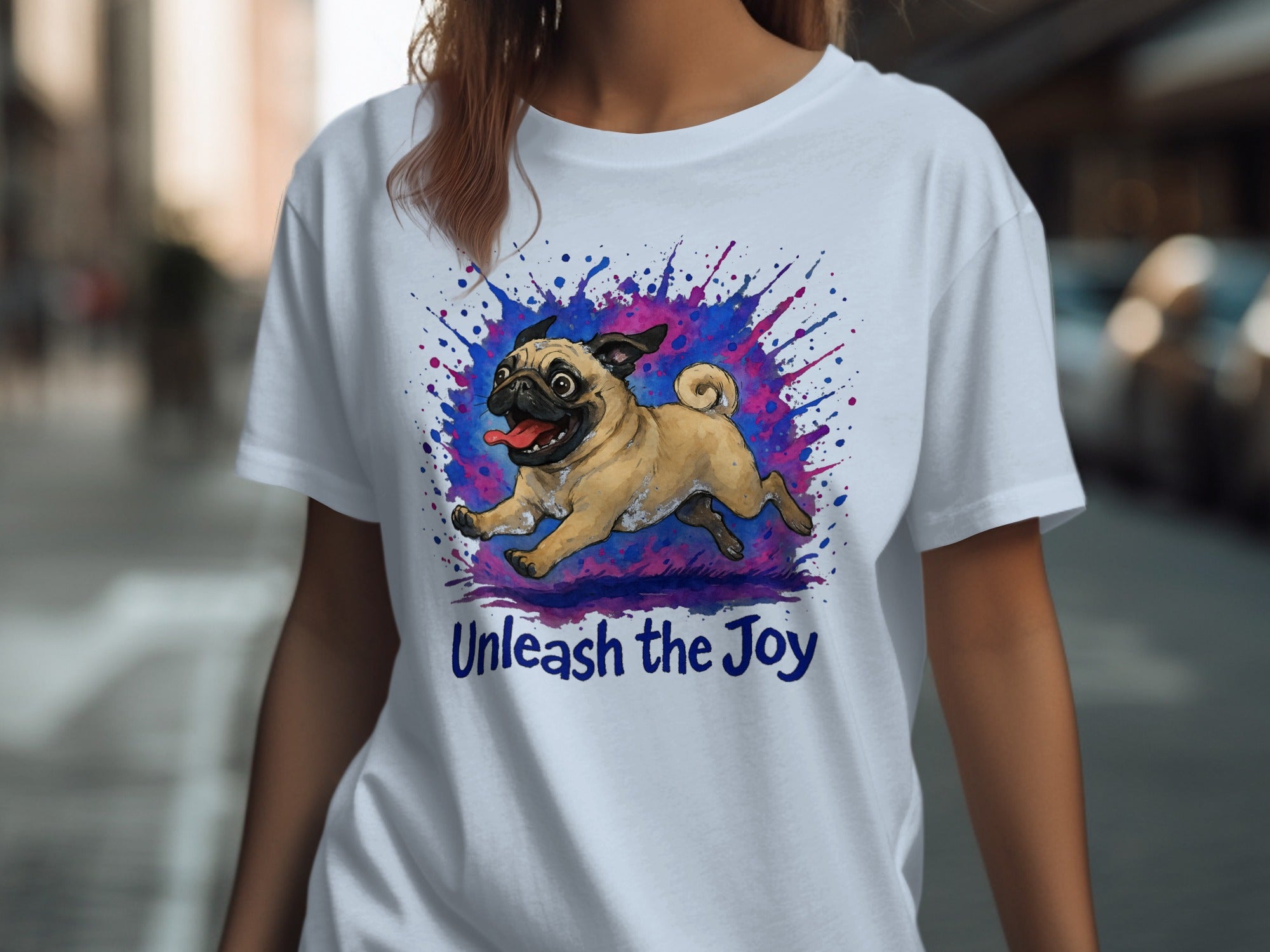 White t-shirt with a running pug graphic and text "Unleash the Joy".
