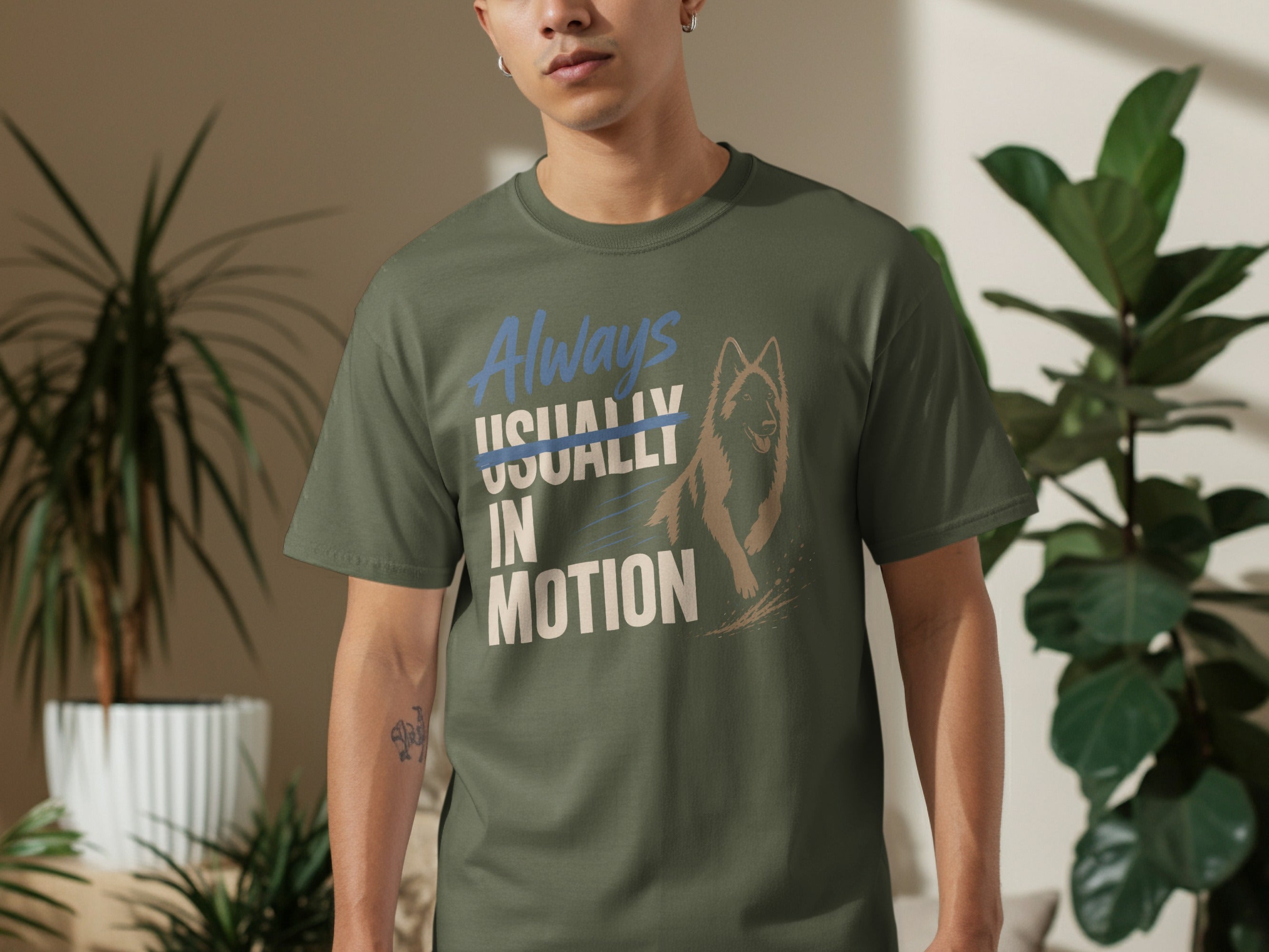 Green t-shirt with dog graphic and text "Always Usually In Motion".