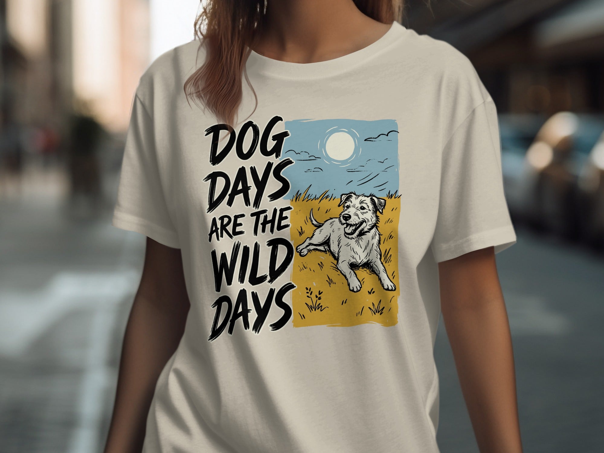 Cream t-shirt with "Dog Days Are The Wild Days" text and a dog in grass.