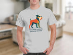 White t-shirt with graphic of a colorful illustrated dog and text "feral little creature, perfectly formed".