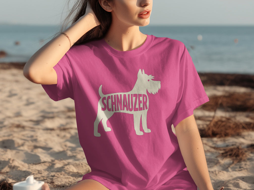 Pink t-shirt with white silhouette of a schnauzer dog and text on the front.