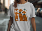 White t-shirt with a graphic of three brown dogs on a bench.