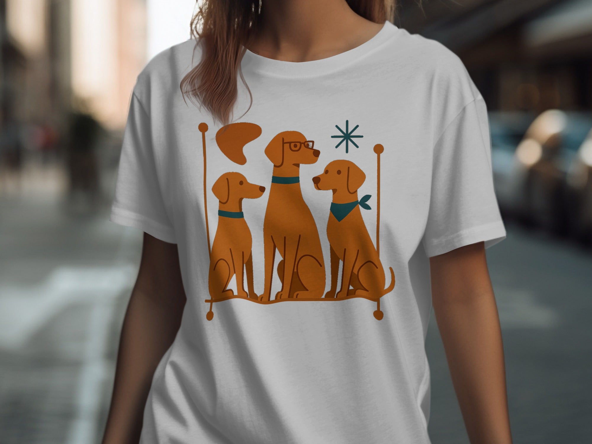 White t-shirt with a graphic of three brown dogs on a bench.