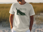 White t-shirt with a black dog and "Stay curious, sniff everything!" text.
