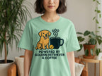 Light green t-shirt with a cartoon golden retriever, coffee cup, and text: Powered by Golden Retriever & Coffee.
