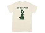 Cream t-shirt with a poodle silhouette and the text "JUDGING YOU WITH PERFECT POSTURE".