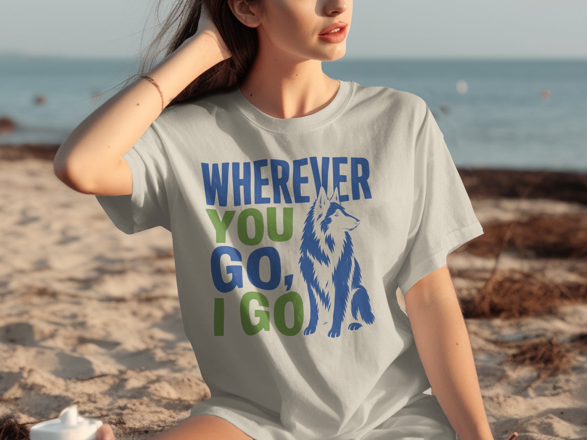 Woman wearing a t-shirt with a wolf and the text "Wherever you go, I go."