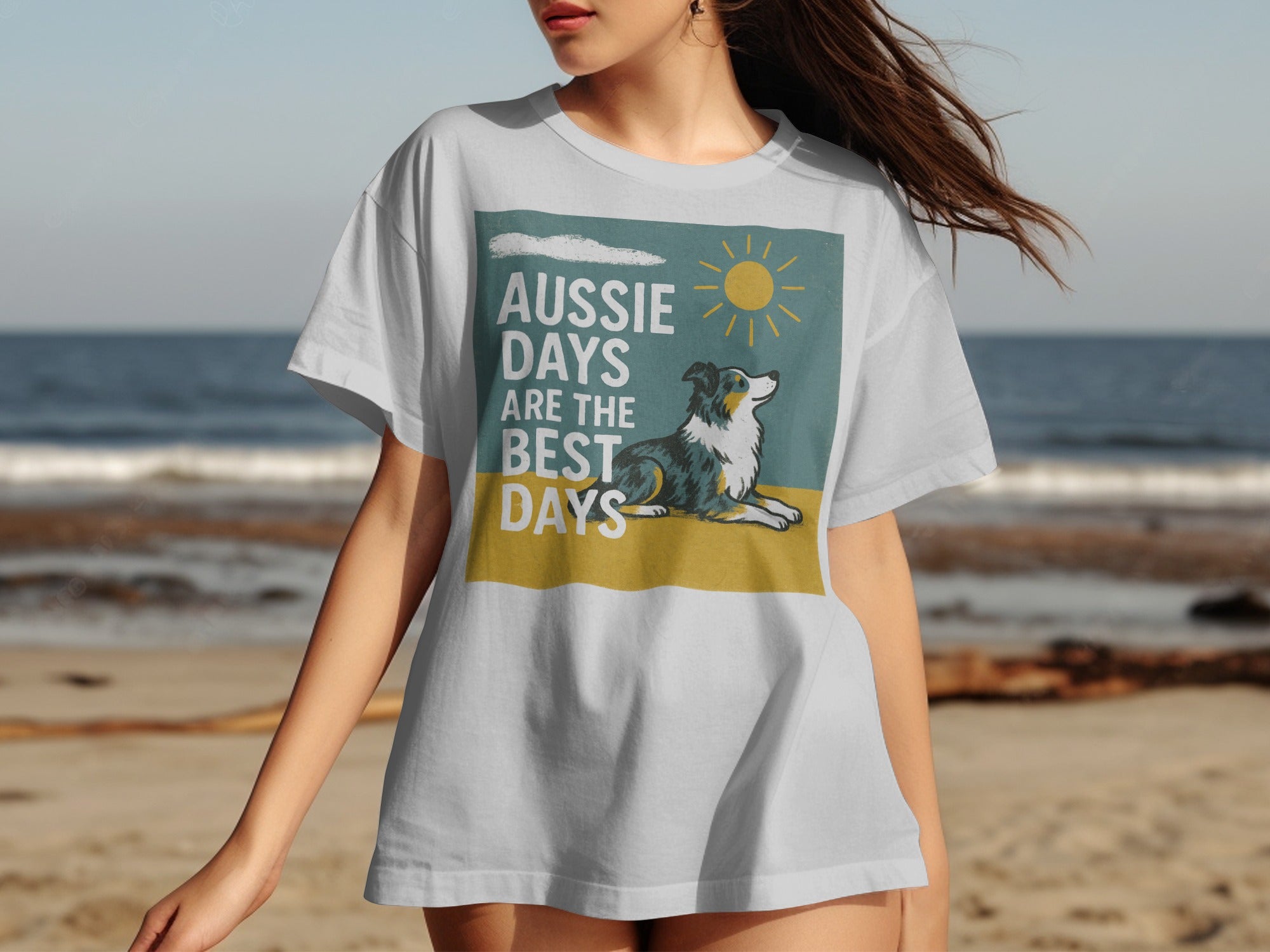 White t-shirt with "Aussie Days Are The Best Days" text and a dog on a beach graphic.
