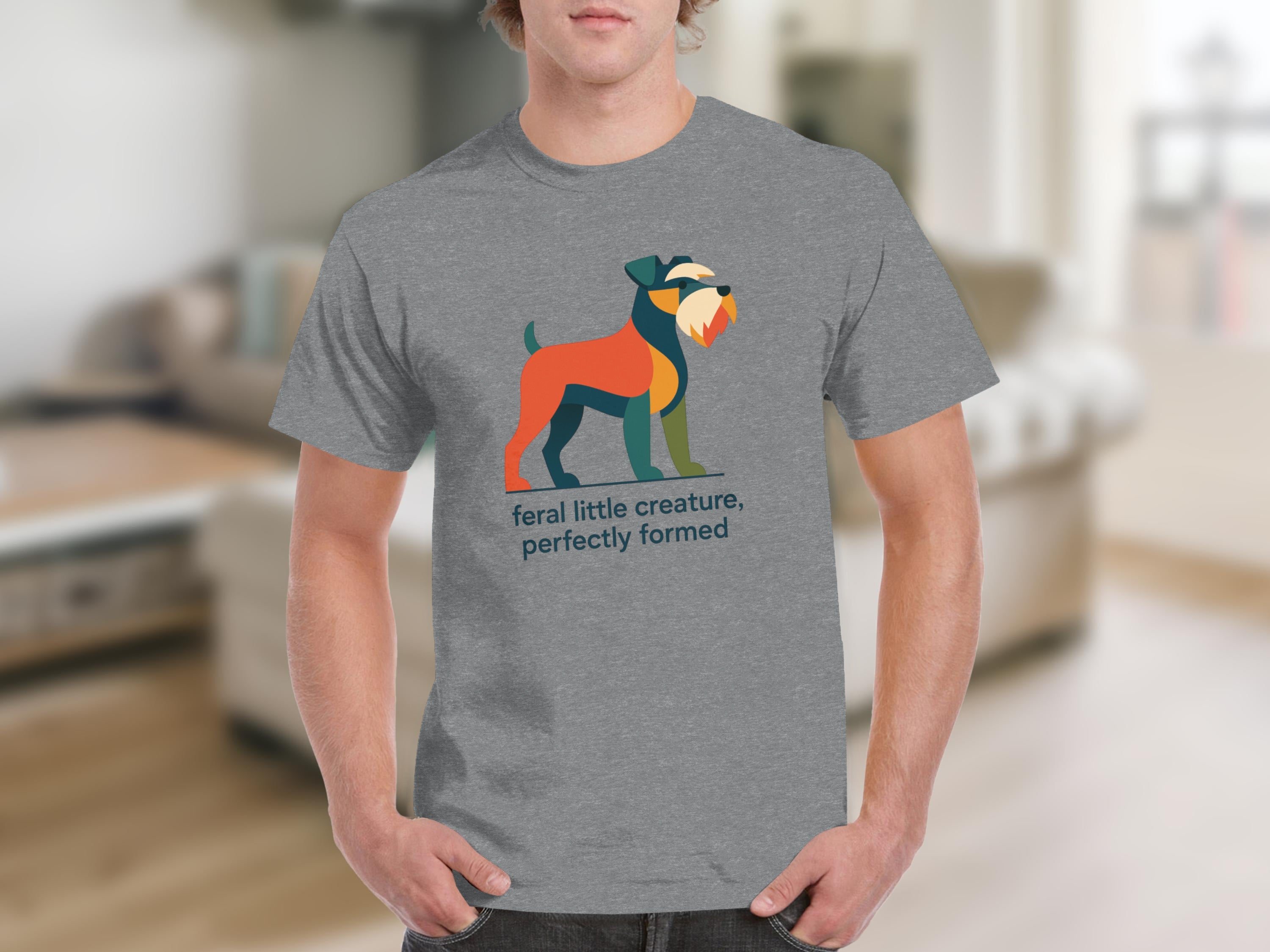 Grey t-shirt with abstract dog graphic and text "feral little creature, perfectly formed".