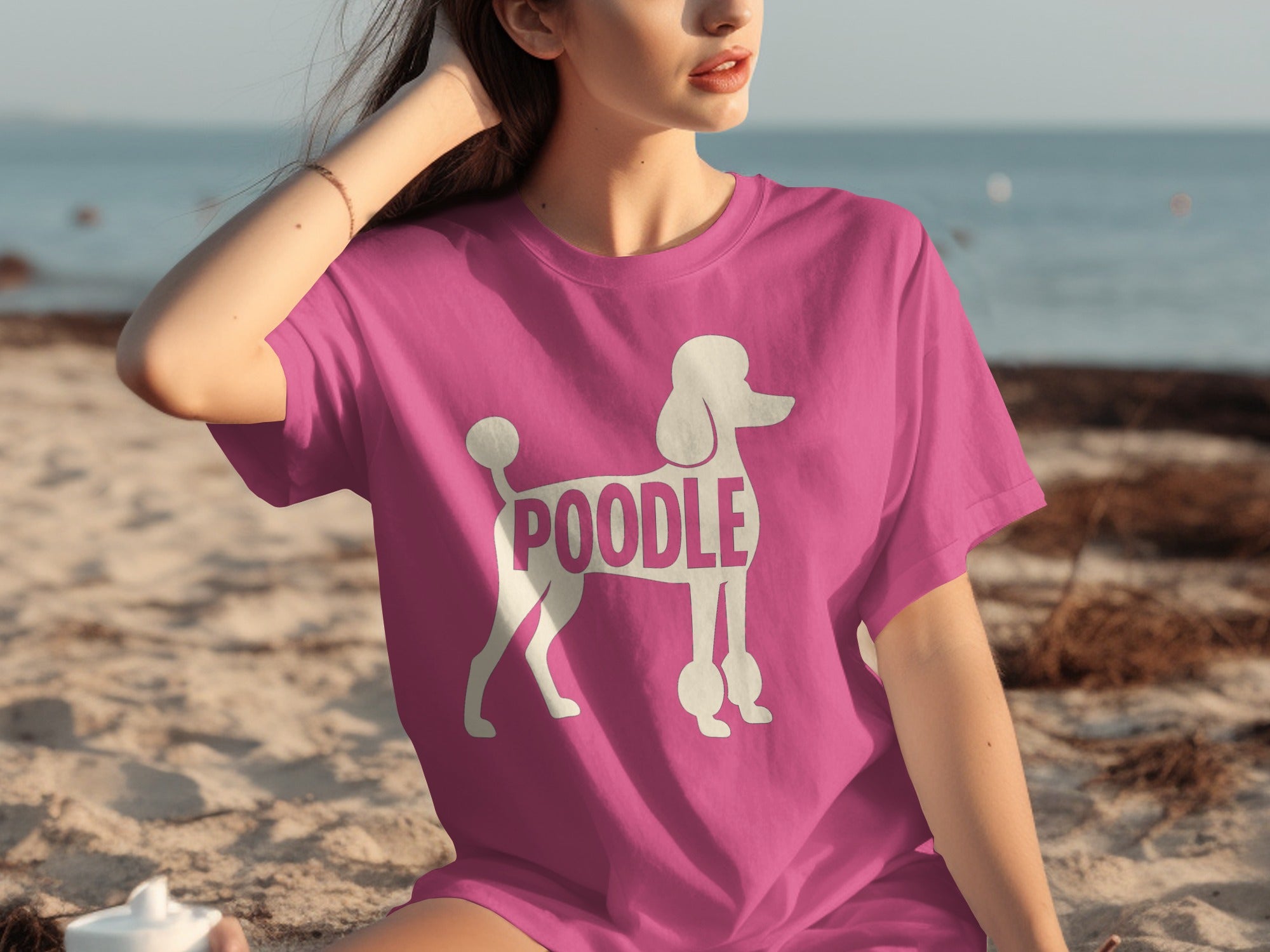 Pink t-shirt with white poodle graphic and "POODLE" text.