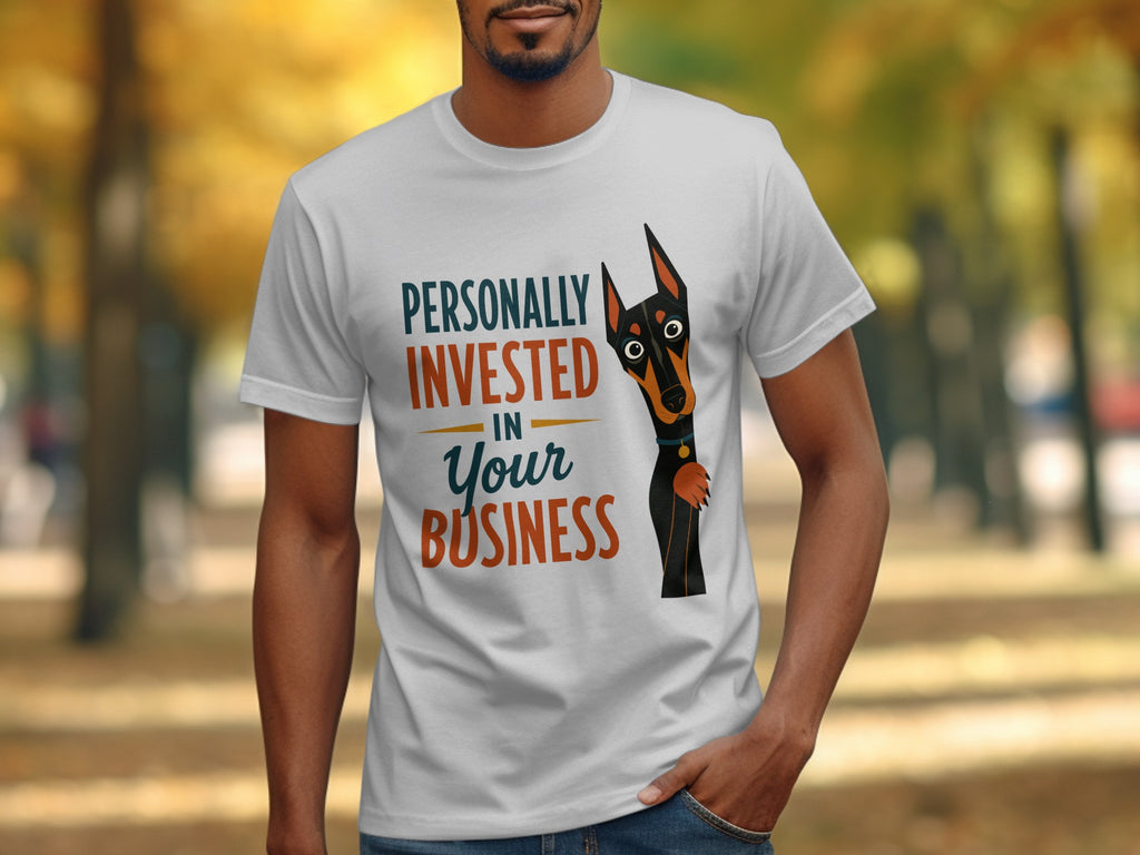 White t-shirt with "Personally Invested In Your Business" text and a surprised dog.
