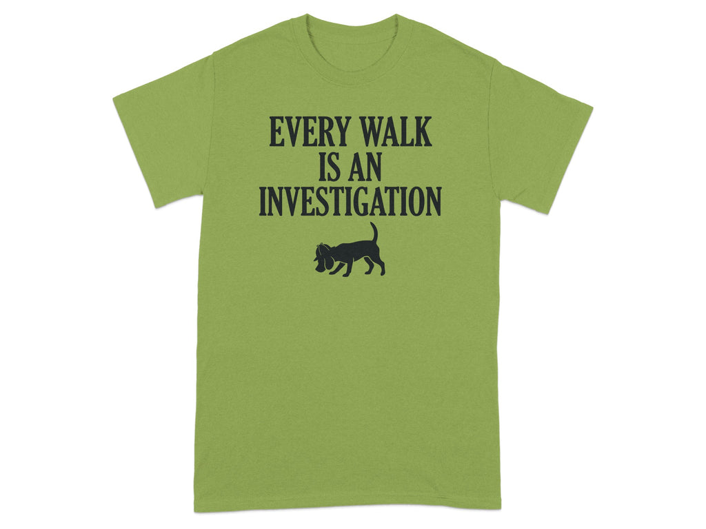Green t-shirt with "EVERY WALK IS AN INVESTIGATION" and a dog sniffing.