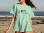 Green t-shirt with graphics: orange German Shepherd silhouette and text "Sorry I Can't. My German Shepherd Said No."