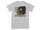 Grey t-shirt with dog wearing detective hat and text "Every Walk Is an Investigation".