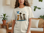 T-shirt with three dogs sitting in a stylized blue border.