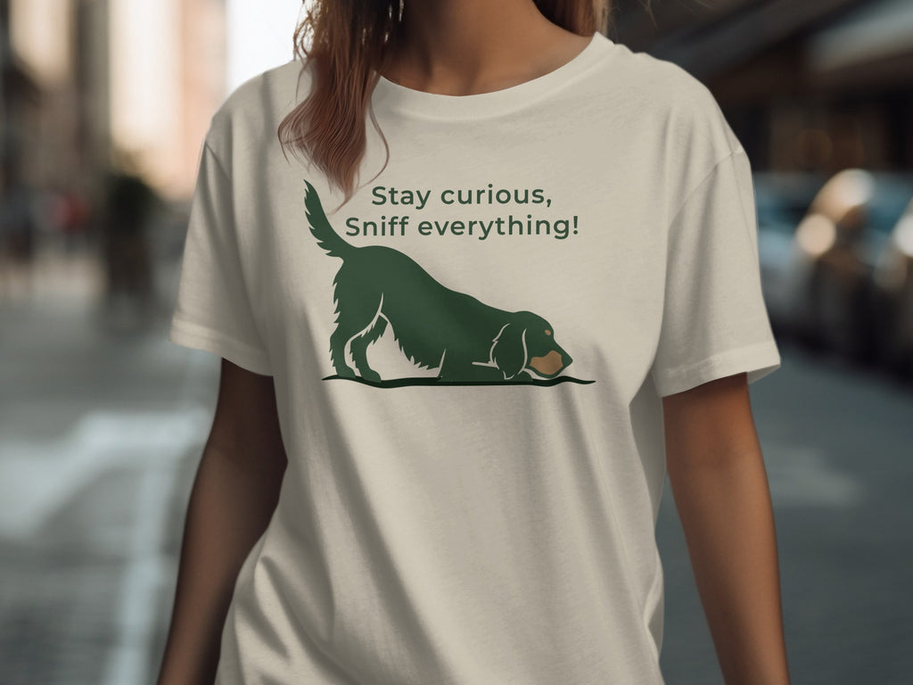 T-shirt with green dog illustration and "Stay curious, sniff everything!" text.
