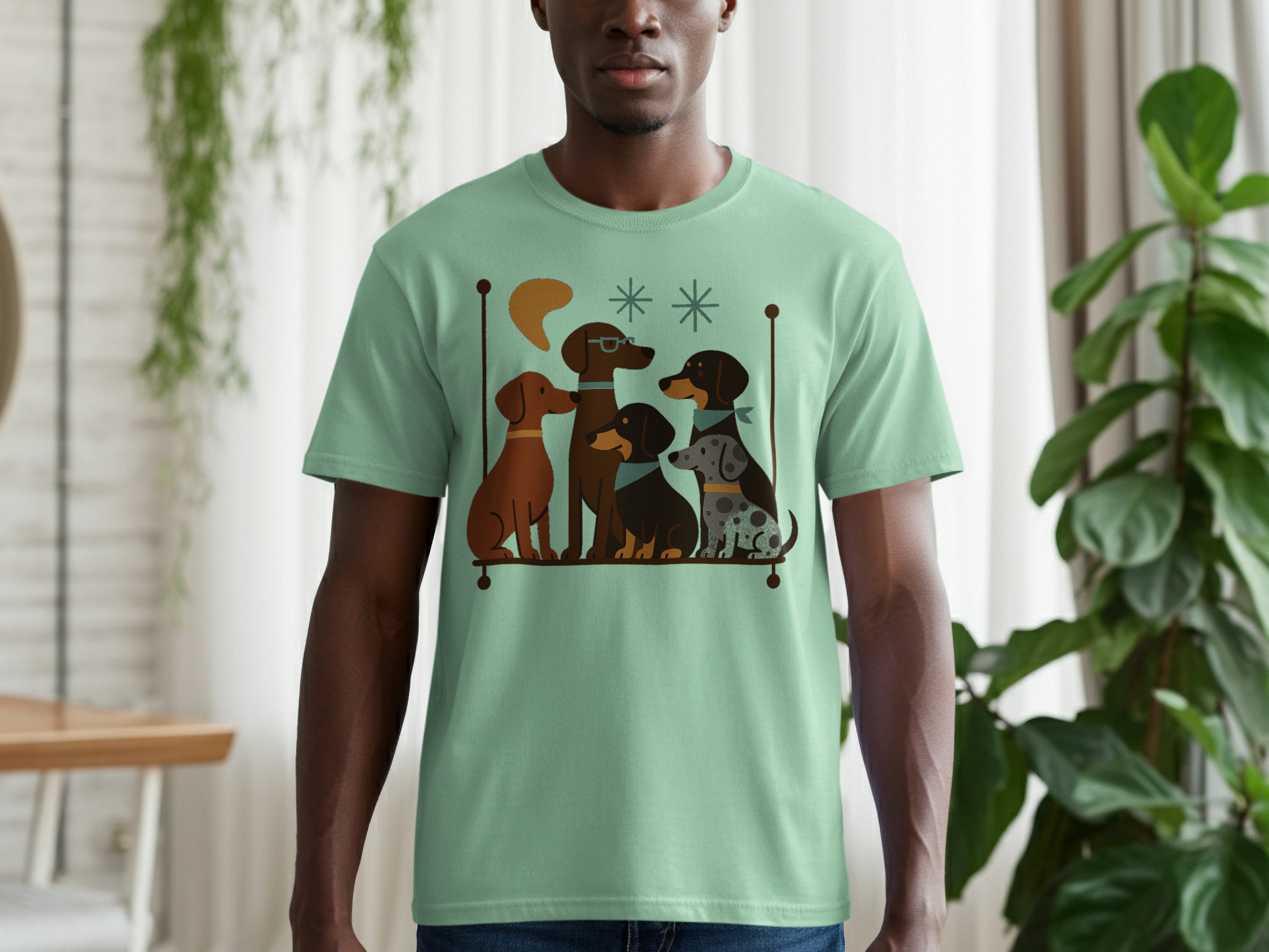 Light green t-shirt with a mid-century style graphic of five dogs sitting.