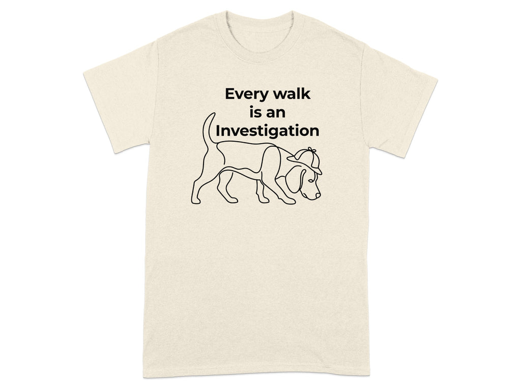 Cream t-shirt with a line drawing of a beagle wearing a detective hat, text "Every walk is an Investigation".