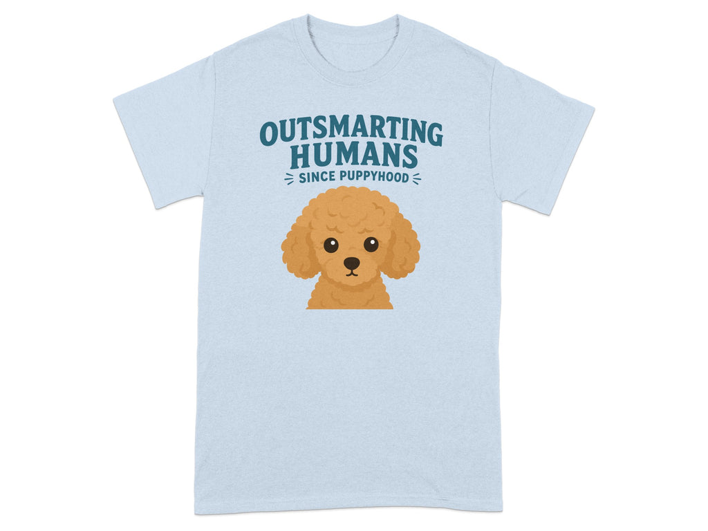 Light blue t-shirt with cartoon poodle and "Outsmarting Humans Since Puppyhood" text.