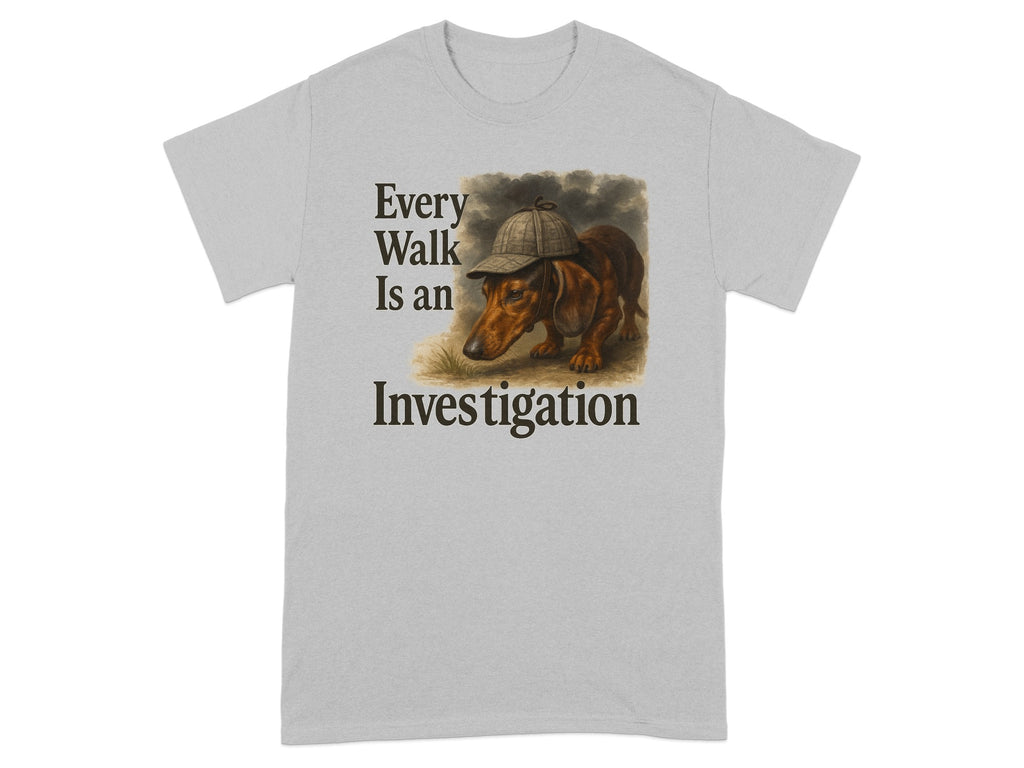 Light gray t-shirt with illustration of a dachshund wearing a deerstalker hat and the text "Every Walk Is an Investigation."