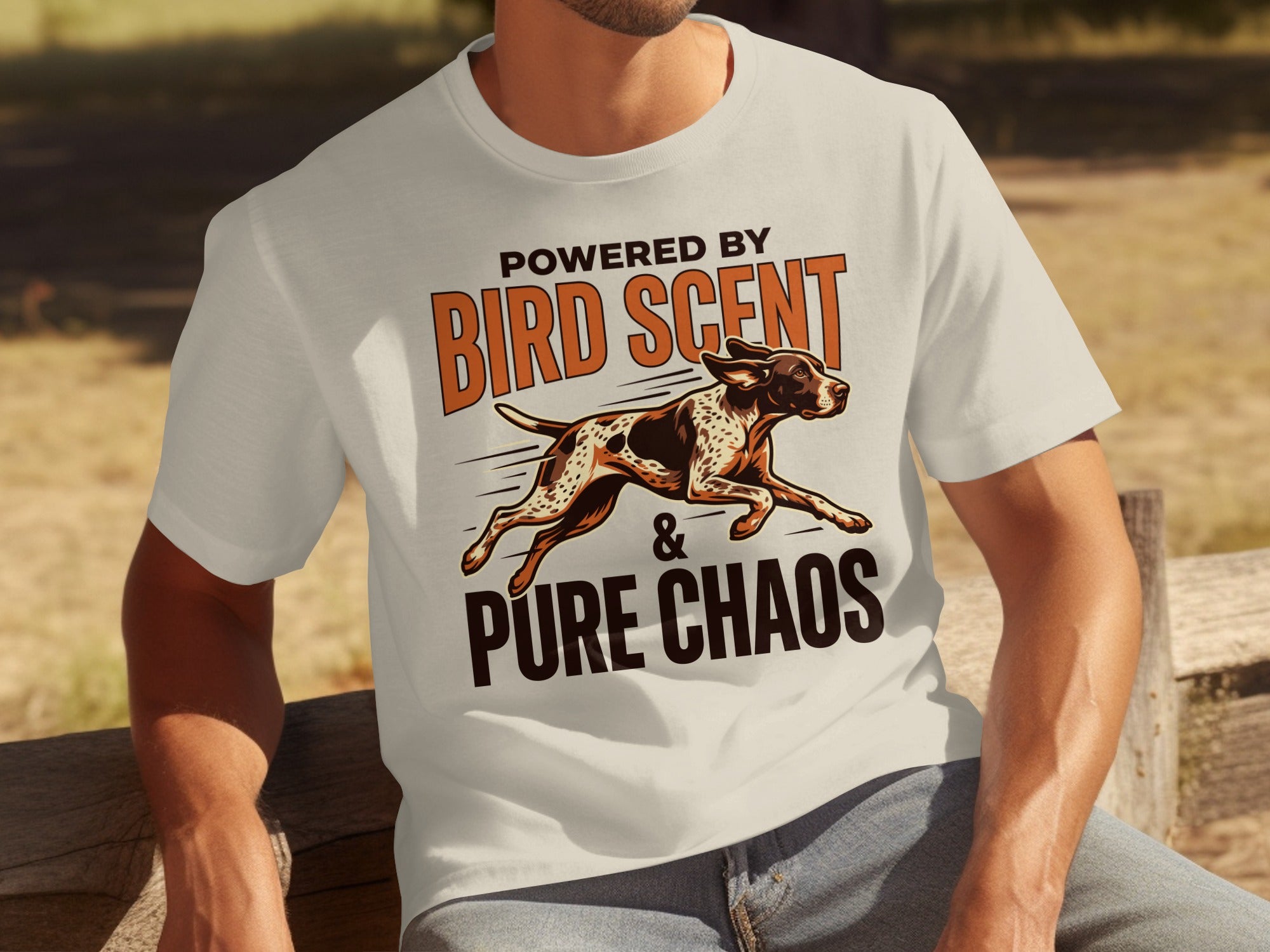 Cream t-shirt with "Powered by Bird Scent & Pure Chaos" and dog graphic.
