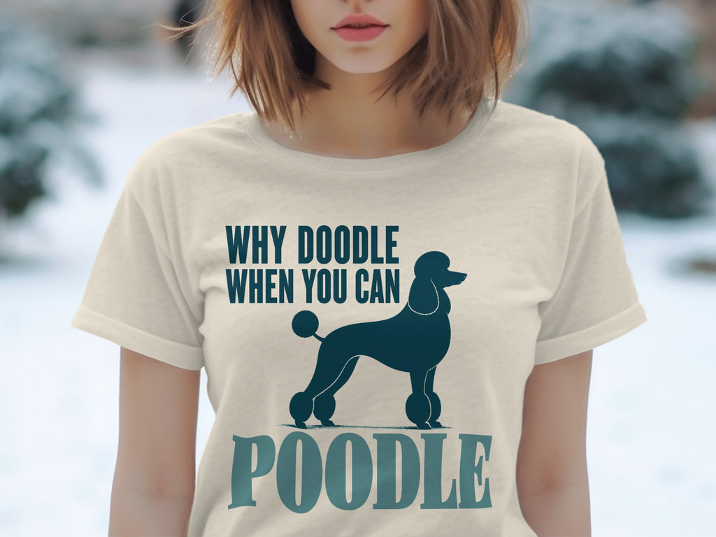 Cream t-shirt with dark blue poodle silhouette and text "WHY DOODLE WHEN YOU CAN POODLE".