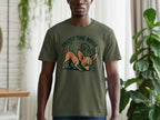 Olive green t-shirt with cartoon dog and "TRUST THE NOSE" text.