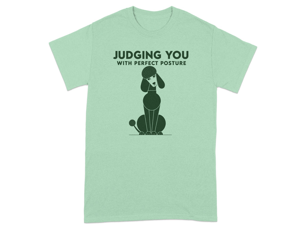 Green t-shirt with a poodle illustration and text "JUDGING YOU WITH PERFECT POSTURE".