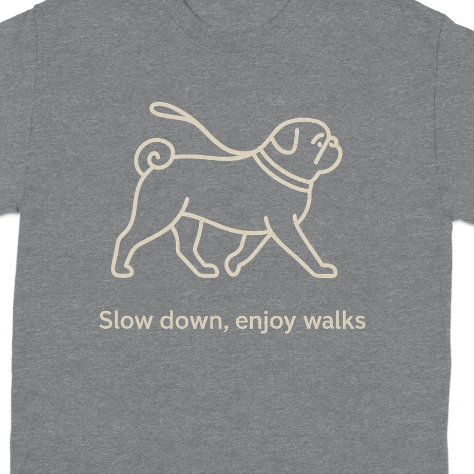 Grey t-shirt with a light brown pug line drawing and text "Slow down, enjoy walks".