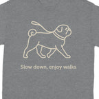 Grey t-shirt with a light brown pug line drawing and text "Slow down, enjoy walks".